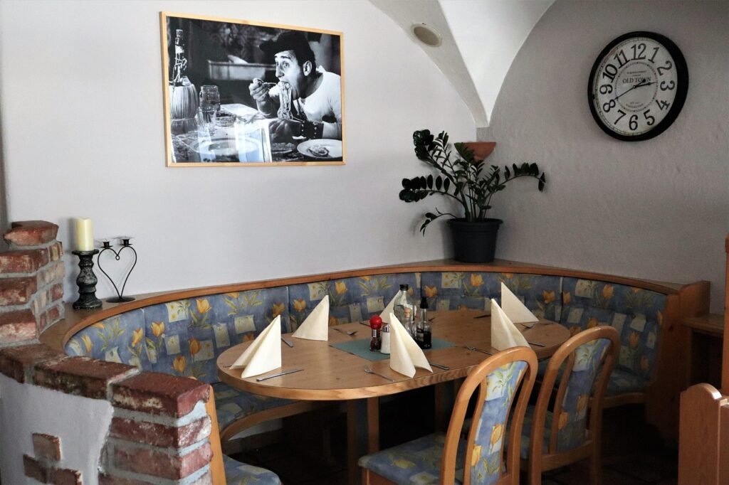 dining room, restaurant, table, bank, chair, setup, restaurants, dinner, hotel, dining table, decoration, picture, wall clock, corner bench, interior, table decoration, meal, event